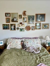 Cozy bedroom gallery wall filled with documentary style wedding pictures