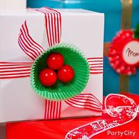 Deck your presents with boughs of gumball holly! Click to see this and more holly jolly Christmas gift wrap ideas.