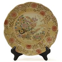 This beautiful plate is made in Satsuma style, which elaborately employs the use of gold. Skillfully handcrafted of fine porcelain and delicately hand-painted with Satsuma motif of bird and flower in the center, this plate creates an interesting focus wherever it is placed. Asian plate decor.