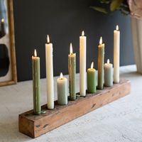 Use this candle display to represent the holidays or illuminate your table. Use this nine-taper holder for mixing and matching sizes or colors of candles. Light up any room with this recycled wood piece. | Millwood Pines 2.5" H Wood Tabletop Candelabra 2.5 H x 3.0 W x 24.0 D in Wood in Brown | 2.5" H X 3" W X 24" D | Wayfair