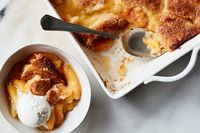 NYT Cooking: Everyone has a different idea about what a cobbler should be. Biscuit-topped? Double-crusted? Cakelike? We’re not here to cast a vote, merely to present a simple Southern cake-style cobbler that makes the most of ripe summer peaches (or the frozen ones languishing in the back of your freezer). All you really need is a bowl, a saucepan, a baking pan and a spoon. This recipe is all about showcasing 