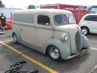 Custom 1949 Ford COE (cab over engine) panel van. The front half is a commercial '49 F-5 COE and the back half is a '49 F-1 Panel Delivery, grafted together at the front pillars. The headlights are custom oversized and the grill is stainless - kinda' rare. And that kinda describes the whole project really.