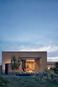 Industrial style meets organic finishes at this contemporary Marfa compound, built by two different architects in the Chihuahuan desert. The minimalist west Texas property has a palette of concrete, aluminium and glass mixed with abode walls and rough plaster. It sits in the remote desert arts town of Marfa, known for its modernist architecture and site-specific artworks by minimalist artist Donald Judd. Photography: Casey Dunn #design #architecture #interiors #minimalism