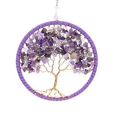 a tree with purple beads hanging from it's center, and a white background