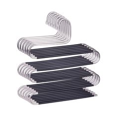 six black and white metal tubes stacked on top of each other, with one long tube in the middle