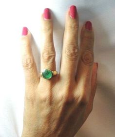 "Colombian Emerald Reversible Ring Set in 18K Gold 7 Natural Round Emeralds / Size ~ 2.67 Carats Color ~ Medium Green / Clarity 5 Round Diamonds / Size ~ .05 Carat total Weight Color ~ G - H / Clarity ~ VS1 - VS2 Metal Purity ~ 18K Yellow Solid Gold / Weight ~ 6.40 Grams TWO RINGS IN ONE ~ VERY UNIQUE ~ THE ENERGY RING Finger Size (7 ) U.S.A and Canada (Sizable) Inquire about sizing ( N 1/2 ) United Kingdom, Ireland, Australia, New Zealand ( 14 ) India, China, Japan, South America (14.5 ) Italy, Modern Gold Emerald Ring, Classic Green Ring With Smooth Bezel, Anniversary Green Ring With Smooth Bezel, Green Fine Jewelry With Smooth Bezel, Gold Emerald Ring With Smooth Bezel As Gift, Yellow Gold Emerald Ring With Smooth Bezel, Gold Emerald Ring With Smooth Bezel For Gift, Round Emerald Ring With Smooth Bezel For Anniversary, Anniversary Round Emerald Ring With Smooth Bezel