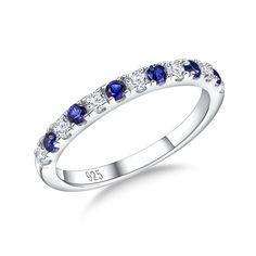 a white gold ring with blue sapphire stones