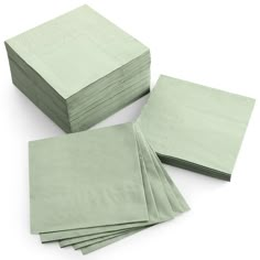 green napkins stacked on top of each other