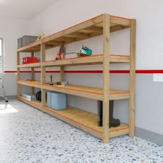 the shelves are lined up with tools and other items on them in an empty room