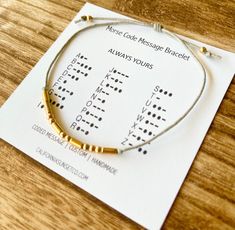 Morse Code Bracelet, Message Bracelet  Any word & Any saying - Word or saying will appear on Card. Max characters 15 -You pick  Color Cord  -You pick Color of beads   -Comes with Morse Code Key Card, & Sheer jewelry bag. -One Size Fits all, Slip Knot. Secret Message Jewelry, Bracelet Morse Code, Bracelet Morse, Morse Code Words, Bracelet Message, Bff Bracelets, Alphabet Jewelry, Coded Message, Slip Knot