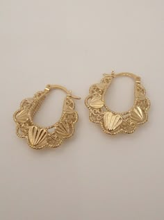 Step into the realm of timeless beauty with our Aphrodite Basket Hoop Earrings. Inspired by the goddess of love and beauty, these earrings are a harmonious blend of elegance, style, and a touch of divine allure. The intricate basket weave pattern adds texture and dimension to the classic hoop earring, creating a unique and eye-catching accessory. Available in 24K gold or rhodium plating over steel Patent plating & sealant technology to ensure durability and long lasting wear Made in Los Angeles, Aphrodite Earrings, Gold Plated Dangle Hoop Earrings With Intricate Design, Ornate Hoop Jewelry For Pierced Ears, Elegant Metal Hoop Earrings With Intricate Design, Elegant Metal Hoop Earrings With Filigree, Gold Plated Hoop Earrings With Elegant Design, Elegant Dangle Hoop Earrings With Intricate Design, Elegant Hoop Jewelry With Intricate Design, Gold Plated Elegant Hoop Earrings