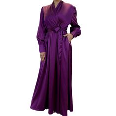 Oozing elegance with a touch of Old Hollywood glam, our V-Neck Satin Wrap Maxi Dress is a stunning choice for formal evening wear. Featuring a luxurious satin material, a modest V neckline, and a fabric waist tie, this dress is perfect to wear for formal events. Pair with flashy heels and matching jewelry for a truly fabulous look. Formal V-neck Belted Dress With Tie Waist, Chic V-neck Dress With Belt, Chic V-neck Dress With Belt Detail, Elegant V-neck Belted Dress For Evening, Formal V-neck Dress With Belt, Elegant Spring Maxi Dress With Belt, Formal V-neck Belted Dress, Formal Belted V-neck Dress, Satin Maxi Dress With Tie Waist