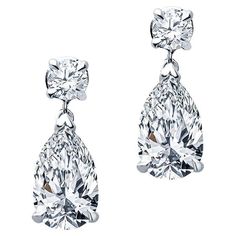 These petite diamond earrings feature 2.35 carat total weight in pear shaped diamonds that dangle from 0.30 carat total weight in round diamonds. They are set in 14 karat white gold with friction post and back. These are delicate to wear everyday but can also shine in the evening! Pear Shaped Diamonds: SI1-SI2, K Formal Teardrop Single Cut Diamond Earrings, Formal Pear-shaped Diamond Earrings With Single Cut Diamonds, Formal Brilliant Cut Diamond Teardrop Earrings, Pear-shaped Diamond Earrings For Formal Events, Formal Brilliant Cut Teardrop Diamond Earrings, Diamond White Brilliant Cut Pear-shaped Bridal Earrings, Diamond White Pear-shaped Teardrop Earrings For Formal Occasions, Classic Teardrop Diamond Earrings With Accents, Classic Pear-shaped Diamond Earrings With Single Cut