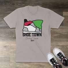 The Shoe Town OG Smoke Grey-inspired T shirt is a premium fitted short sleeve that offers lightweight comfort, making it a classic choice for everyday wear. The high-quality print adds a striking statement to your attire. Representing Oregon's sneaker legacy, Shoe Town signifies a movement that began in 1971. Let this shirt speak volumes about your fashion sensibilities and connection to a rich history. .: 100% combed, ring-spun cotton (fiber content may vary for different colors) .: Light fabric (4.3 oz/yd² (146 g/m .: Premium fit .: Runs bigger than usual Sneaker T Shirts, Wear-resistant Gray Sneakers For Streetwear, Retro Gray T-shirt For Streetwear, Sneaker Head Tshirt, Purple Sneakers, Green Sneakers, University Blue, Grey Sneakers, Blue Sneakers