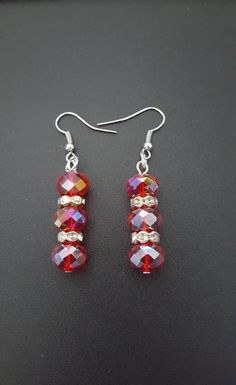 Silver Crystal Beaded Earrings For Gift, Handmade Red Crystal Drop Earrings, Red Beaded Crystal Drop Earrings, Red Crystal Dangle Earrings, Red Beaded Drop Crystal Earrings, Silver Crystal Beaded Drop Earrings, Red Czech Glass Beaded Earrings With Dangling Beads, Red Beaded Czech Glass Earrings, Red Handmade Dangle Crystal Earrings