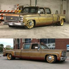 an old truck with gold rims is parked in front of a brick building and another one has yellow wheels on it