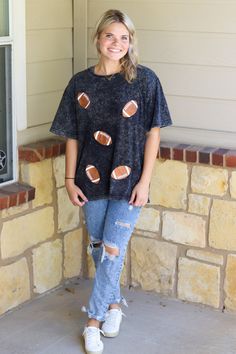 Short sleeve washed sparkly football graphic.McKenna is wearing a size Medium Full length teelight weightblack washed colorRuns true to sizeHEY BABE! WE ONLY OFFER STORE CREDIT FOR RETURNS! Feel free to email us or DM us on Instagram with any questions regarding fit or sizing or our return policy in general. Sequin Football Shirt, Black Washed T-shirt For Fall, Sporty Graphic Print Top For Tailgating, Sporty Crew Neck Top For Tailgating, Sporty Short Sleeve Tops For Tailgating, Sporty Black Washed T-shirt, Sporty Black Washed Top, Black T-shirt For Game Day In Fall, Black T-shirt For Fall Game Day