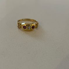 Antique 18k Garnet Diamond Gypsy Ring From Birmingham C 1901. This Yellow Gold Edwardian Ring Features Two Round Cut Garnets And One European Cut Diamond In A Marquis Setting. The Shoulders Of This Antique Ring Have A Columnar Architecture To Them. Ring Is Sized To 6 3/4; There Is A 18k Stamp Inside. Luxury 14k Gold Three-stone Ring, Luxury 14k Gold Three Stone Ring, Gold Three Stone Round Band Ring, Luxury Three Stone 14k Gold Ring, Formal Gold Three Stone Rings, Victorian 14k Gold Diamond Ring With Gemstone, Vintage Multi-stone Ruby Ring In 14k Gold, Luxury Gold Three-stone Ring, Luxury Gold Three Stone Ring