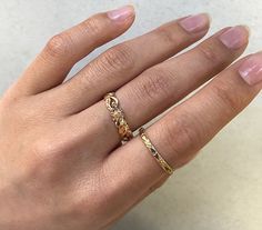 "Vintage 1940s engraved wedding band. Never been worn - what I call \"New/Old Stock\". The solid 14k yellow gold band is engraved with delicate orange blossom flowers and a milgrain edge. The band is simple and elegant on its own, but can be stacked and paired with other accessories for a lovely statement look. Other pictures show different stacking rings together and on a hand to give ideas and more details. The primary picture is the item for this listing. More information: -2.3mm -) wide (the Engraved Wedding Band, 1940s Wedding, Wedding Band Engraving, Engraved Wedding, Stackable Bands, Plain Bands, Band Photos, Gold Engraving, Deco Engagement Ring