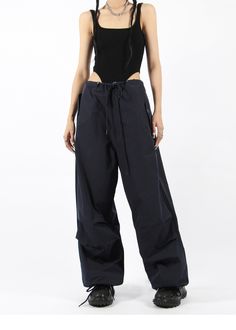 There’s a new trend in town, and it’s nightcity clothing’s Button Pocket Oversized Parachute Pants. These comfy, lightweight pants look great when paired with a crop top or graphic tee and sneakers. With a drawstring waistline, these pants are comfortable and secure, and the oversized fit gives them an effortless and chill look. Add these pants to your wardrobe, and you’ll never have a dull moment — you’ll always be ready for an impromptu night out, no matter how casual it might be.
Gender: Wome Urban Straight Pants For Summer, Urban Summer Bottoms, Edgy Baggy Summer Pants, Urban High Waist Parachute Pants For Summer, Urban High-waist Parachute Pants For Summer, Urban Style Summer Trousers, Trendy Wide Leg Cargo Pants For Night Out, Trendy Straight Cargo Pants For Night Out, High Waist Cargo Pants For Summer Night Out