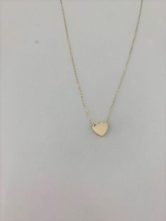 14k Solid Gold Heart Necklace, Bold Heart 14k Gold, Hollow Heart, Bold Hollow Gold Heart, Dainty Necklace, Layering Necklace, Gold Heart Necklace ------------------------------------------------------------------------------------------------ The Heart Necklace is a beautiful, affordable dainty 14K Solid Gold piece of jewelry that is great for everyday wear. It comes available just in yellow gold. This necklace can be used in combination any of our other necklaces for a layering effect. A great 14k Gold Heart Cut Necklace With Adjustable Chain, 14k Gold Heart Pendant Necklace With Adjustable Chain, 14k Gold Heart Charm Necklaces With Adjustable Chain, 14k Gold Heart Charm Necklace With Adjustable Chain, 14k Gold Necklace With Heart Charm And Cut, 14k Gold Heart Necklace With Adjustable Chain, 14k Rose Gold Heart Pendant Necklace, Rose Gold 14k Heart Pendant Necklace, 14k Gold Heart Necklace With Heart Charm