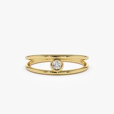 a gold ring with a diamond on it