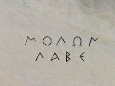 the word moon ark written in black ink on a white paper sheet with writing underneath it