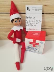 an elf is sitting next to a box of toothpaste