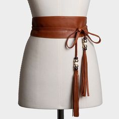 This Brown sash belt is made of smooth and supple lamb leather. It is an elegant women's belt that reinforces its appeal with two tassels at its ends.  Each tassel is decorated with five small crystal balls in gold, brown, and beige metallic colors. A brown belt that combines very well with all kinds of dresses, tunics, blouses, etc. It is usually worn around the waist and tied in the front. This is a handmade product in which we have used the best natural leather. Color and appearance may vary Leather Obi Belt, Gold Sash, Boho Belts, April Birthstone Jewelry, Crystal Balls, March Birthstone Jewelry, Obi Belt, August Birthstone Jewelry, Belt Design