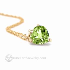 A lovely heart shaped Peridot necklace in 14K Gold.  This natural Peridot pendant has an 8mm heart cut green Peridot gemstone and comes in 14K White Gold, Yellow Gold or Rose Gold with a 16 inch, 18 inch or 20 inch 14K chain.  Gorgeously feminine!  This heart pendant would make a wonderful gift for an August birthday or push present.  Made to order.  Please allow 2 to 3 weeks for delivery. For more beautiful Peridot jewelry, click here: http://www.etsy.com/shop/RareEarth/search?search_query=peridot Official Website: www.RareEarthJewelry.com Fine Jewelry May Birthstone Heart Cut Necklace, Yellow Gold Heart Cut Jewelry For May Birthstone, Green Necklace With Heart Charm For Anniversary, Fine Jewelry Green Heart Jewelry, Green Heart Charm Necklace For Anniversary, Luxury Peridot Jewelry For Gifts, Green 14k Gold Heart Jewelry, Fine Jewelry Peridot Necklace For Anniversary, Green Peridot Jewelry For Gift