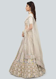 Alabaster applique and embellished heavy kali mirror work net lehenga with broad lehenga border, blouse and broad border net dupatta. Cream Dress With Sheer Dupatta For Navratri, Off White Dupatta With Mirror Work, Traditional Drape, Off White Dupatta With Mirror Work, Cream Anarkali Set With Mirror Work For Navratri, Bollywood Style Beige Lehenga With Cutdana, Bollywood Beige Lehenga With Cutdana, Cream Lehenga With Dupatta For Reception, Beige Semi-stitched Lehenga With Cutdana, Off White Dupatta With Mirror Work For Diwali