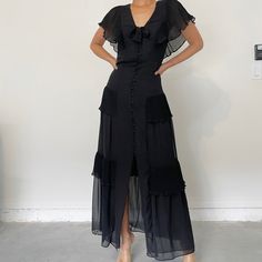 Black Ruffle Maxi Dress Black Cocktail Midi Dress With Ruffle Hem, Black Ruffled Skirt Evening Dress, Black Ruffled Skirt Dress For Evening, Black Maxi Dress With Ruffle Hem For Party, Black Ruffle Hem Maxi Dress For Party, Black Maxi Dress With Ruffles, Black Midi Dress With Ruffles, Black Midi Dress With Ruffle Hem For Formal Occasions, Black Ruffle Hem Midi Dress For Formal Occasions