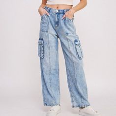 Step into the urban-chic vibe with our High Waist Baggy Denim Cargo Trousers, perfectly blending style and functionality. These jogger-style trousers are tailored to a flattering high-waist fit, designed to elongate your silhouette while providing comfort with an elastic waist. Featuring a multitude of pockets — hip, back, and side knee cargo — they offer ample storage for your essentials. The straight-leg cut maintains a sleek profile, and the combination of button and zippered closures ensures Casual Mid-rise Cargo Jeans For Spring, Trendy Mid-rise Jeans For Elevated Casual Occasions, Trendy Mid-rise Jeans For Elevated Casual, Trendy Elevated Casual Cargo Jeans With Pockets, Spring Utility Mid-rise Cargo Jeans, Casual Cargo Jeans For Fall, Spring Mid-rise Utility Cargo Jeans, Trendy Relaxed Fit Jeans For Elevated Casual Occasions, Trendy Relaxed Fit Jeans For Elevated Casual