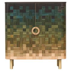 a wooden cabinet with an abstract design on the front and side panels in different colors