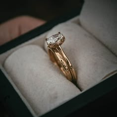 a close up of a ring in a box