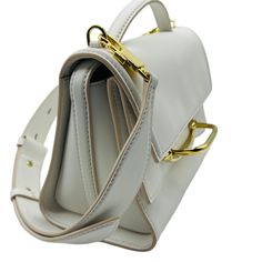 Made of leather: Top handle: Snap closure: Inside card slots: Suede lining; Adjustable and detachable leather cross-body strap: Gold tone hardware; Measurements: 8.5 L x 6.5 H x 4 D, Adjustable shoulder strap up to 21.5 drop in inches; Comes with tag and dust bag; Made in Italy. Timeless Crossbody Flap Bag With Palladium Hardware, Formal Cream Shoulder Bag With Palladium Hardware, White Satchel With Removable Pouch For Business, White Shoulder Bag With Palladium Hardware For Formal Occasions, White Business Satchel With Removable Pouch, White Business Bag With Adjustable Strap, White Business Bag With Detachable Strap, White Business Bags With Detachable Strap, Business Flap Bag In Beige With Detachable Strap