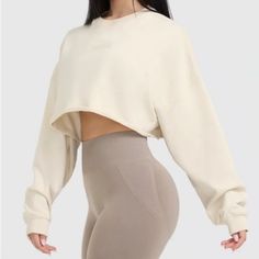 Brand New With Tags!! Oner Active Raw Lounge Crop Sweatshirt / Nwt / Color: Off White / Size: S Cropped Crewneck Sweatshirt With Oversize Silhouette And Over Size Sleeves. Add A 90s Spin To Your Look With The Raw Lounge Crop Sweatshirt. This Throw-On Top Is Made From Lightweight Cotton Fleece That Has A Washed Finish For A True Worn-In Feel. Lightweight Cropped Sweatshirt Made From Marble-Washed Cotton Fabric Rib Neckline For Comfort Ribbed Cuffs With Coverstitch Detailing Raw Edge Hem For A Vin Oversized Crew Neck Crop Top In Athleisure Style, White Crew Neck Cropped Sweater, White Long Sleeve Cropped Sporty Sweater, White Relaxed Fit Cropped Sweater With Crew Neck, White Cropped Sweatshirt For Winter, White Cotton Cropped Sweater For Loungewear, Oversized White Crop Top With Crew Neck, White Oversized Crew Neck Crop Top, Oversized Off White Tops For Winter