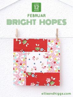 a piece of fabric hanging on a clothes line with the words, february bright hopes