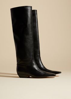 The Marfa Knee-High Boot in Black Leather– KHAITE Luxury Fitted Square Toe Knee-high Boots, Luxury Fitted Knee-high Boots With Square Toe, Luxury Knee-high Boots With Sculpted Heel And Square Toe, Luxury Calf Leather Knee-high Boots With Square Toe, Fitted Calf Leather Heeled Boots With Square Toe, Luxury Knee-high Boots With Square Toe For Fall, Luxury Square Toe Knee-high Boots For Fall, Fitted Square Toe Calf Leather Heeled Boots, Calf Leather Heeled Boots With Square Toe For Fall