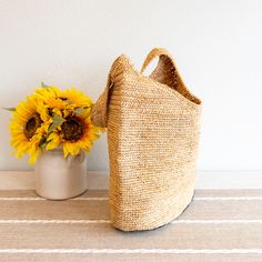 IN STOCK FAST SHIPPING FROM LOS ANGELES Take on any adventure with our handmade raffia straw bag! Its natural color and durability make it perfect for everyday use and the beach. With a strong shoulder strap, you can confidently carry all your essentials with ease. Upgrade your summer style with this bold and sturdy bag! Natural Soft Raffia Straw Handmade Size: 14"H x 13.5"W Strap drop length: 13" Designer Style ID: 8630 Natural Palm Leaf Shoulder Bag For Market, Handmade Palm Leaf Straw Bag For Everyday, Natural Handwoven Straw Bucket Bag, Natural Jute Bucket Bag, Natural Straw Bags With Fair Trade Details, Natural Straw Bags With Fair Trade, Natural Fiber Crochet Bucket Bag For Market, Burlap Straw Bag For Beach In Summer, Jute Bucket Bag For Market