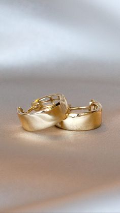 An updated take on a classic look, these wide huggie hoop earrings are perfect for chic, everyday wear. #hoop #hoopearrings #brilliantearth #gold #goldhoopearrings #huggie #huggieearrings #trend #finejewelry #classic Tarnish Resistant Huggie Earrings For Formal Occasion, Yellow Gold Huggie Hoop Earrings With Shiny Finish, Formal Tarnish-resistant Huggie Earrings, Gold Plated Huggie Hoop Earrings For Formal Events, Formal Small Hoop Huggie Earrings With Shiny Finish, Formal Small Hoop Huggie Earrings, Formal Huggie Earrings, Elegant Yellow Gold Huggie Earrings, Formal Gold Plated Huggie Earrings With Shiny Finish