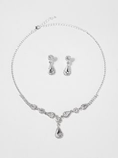 Enhance your bridal look with our elegant Regan Rhinestone Marquise Drop Bridal Set. Featuring sparkling marquise-cut rhinestones, this set adds a touch of sophistication to any wedding ensemble. With its timeless design and quality craftsmanship, this set is the perfect choice for any bride looking to make a statement on her special day. SizeL: 15" Ex: 4" QualityCrafted from premium materials for quality and endurance. ImportedN11976 Marquise Wedding Jewelry With Sparkling Stones, Marquise Diamond Bridal Necklace In Silver, Elegant Marquise Bridal Necklace In Cubic Zirconia, Elegant Sterling Silver Marquise Bridal Earrings, Formal Silver Marquise Bridal Necklace, Silver Wedding Jewelry, Pearl Shop, Iridescent Crystal, Bridal Look