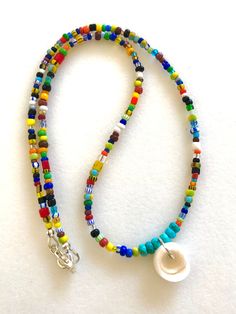 Multicolor Heart Beads Necklace For Beach, Artisan Multicolor Beaded Necklace For Beach, Multicolor Heart Beads For Beach, Large Heishi Beads For Beach, Bohemian Rainbow Beaded Necklaces With Heart Beads, Bohemian Rainbow Beaded Necklace With Heart Beads, Vacation Beaded Necklaces With Large Beads, Rainbow Spiritual Jewelry For Beach, Spiritual Large Beaded Necklaces For Beach