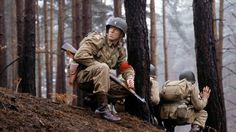 two soldiers sitting in the woods talking to each other with speech bubbles above their heads