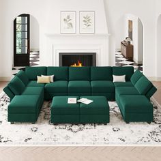 a living room with a large green sectional couch and matching footstool in front of a fireplace