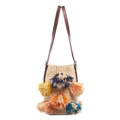 DESCRIPTION The colorful Rainbow Pom Pom straw designer bag is handcrafted in Ghana from natural and dyed raffia. The luxury African handbag has two sturdy, adjustable top handles that are made of 100% leather, making this purse convenient to carry. The linen lined interior has one inner pocket for organization. This woven straw designer bag is a stylish shoulder purse to carry in the summer or to bring to a poolside evening gathering. DETAILS Handmade in Ghana Measurements: H9'' x W14'' Materia Purse Design Ideas, Purse Design, Rainbow Bag, Colorful Handbags, Bohemian Bags, Bags Messenger, Crochet Purse Patterns, Woven Raffia, Traditional Weaving