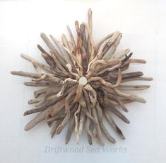 a large piece of driftwood is mounted on the wall and has been used as a decoration