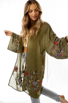 Nothing is more fun than a kimono covered in floral! This perfect layering piece features a sheer fabric in a longline silhouette with accents of crochet florals in multicolors along the hem and wide sleeves.Model is 5'8" and wearing a one size.100% Polyester OS sizing fits most* sizes US 0-18Length: 38 inBust Across: 25 inSleeve Length: 17 inSleeve Opening: 11 in Import Ceremonial Clothing, Three Bird Nest, Padded Bralette, Rocker Style, Print Kimonos, Hooded Cardigan, Bird Nest, Sheer Fabric, Jacket Design