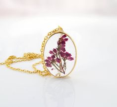 "Flower necklace / Terrarium jewelry / Mothers day gift for her / Pressed flower / Terrarium necklace / Plant jewelry Anniversary gift / gift for women / Woodland The pendant is a dainty gold plated open back bezel in an oval shape. They are so pretty, yet lightweight. The pendant measures about 1 1/3\" x 1\" oval (35mm x 25mm). A shiny silver tone 18\" snake chain is included. All jewelry items will come to you nicely packaged in a gift box. Purchase the listing below if you want to have your o Nature-inspired Flower Charm Necklace For Gift, Delicate Oval Pendant Necklace For Gifts, Botanical Jewelry With Pressed Flowers, Elegant Pressed Flower Necklace For Mom, Delicate Pressed Flowers Necklaces As Gift For Her, Delicate Pressed Flowers Necklace As Gift For Her, Delicate Pressed Flower Necklace For Her, Nature-inspired Necklace With Adjustable Chain For Gift, Nature-inspired Necklace With Adjustable Chain As Gift