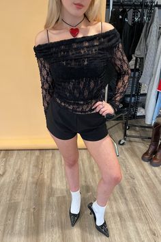 Also available in Cream. Styled with the Feel Alive Black Micro Mini Shorts. Product Deets Black lace long sleeve top 90% nylon, 10% elastane Delicate floral lace fabric Self lined in front for a little extra coverage Drapey neck, can be worn off one or both shoulders Ruching on sides and shoulders Size small measures 15” long Runs true to size Model Info Marley is 5’5. Waist: 26" Bust: 32B Wearing size Small. Long Sleeve Lace Patchwork Top For Night Out, Black Lace Tops With Lace Cuffs, Casual Long Sleeve Stretch Lace Top, Stretch Casual Long Sleeve Lace Top, Stretch Lace Top With Lace Collar, Sheer Sleeves Lace Top For Night Out, Stretch Lace Sleeve Top, Stretch Lace Off-shoulder Top, Long Sleeve Lace Top For Date Night